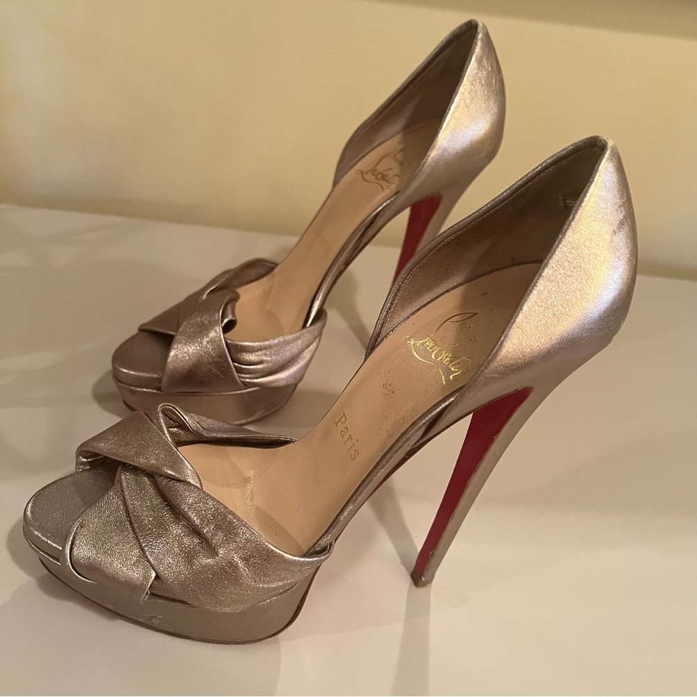 Authentic Christian Louboutin’s size 37 1/2 color metallic/silver